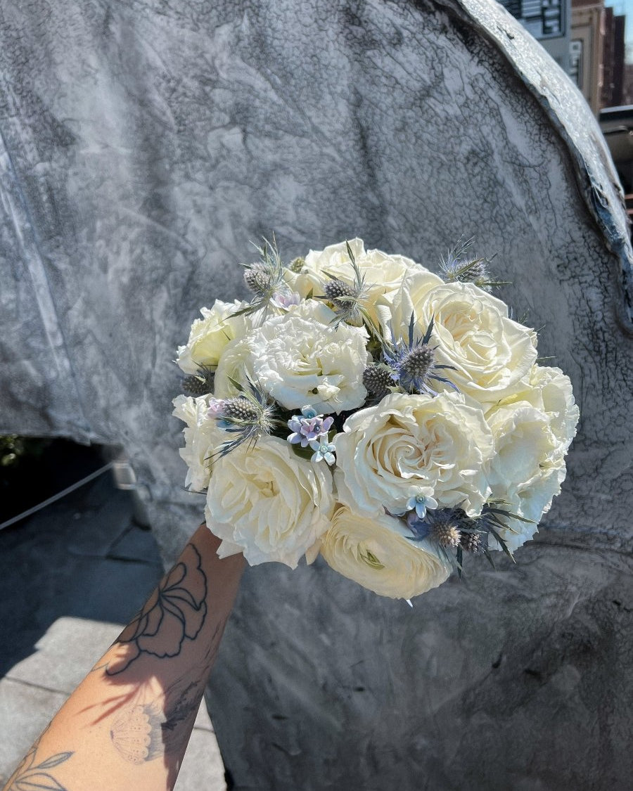 wedding-bouquet-frosted-bloom-ivory-roses-blue-eryngium-nyc