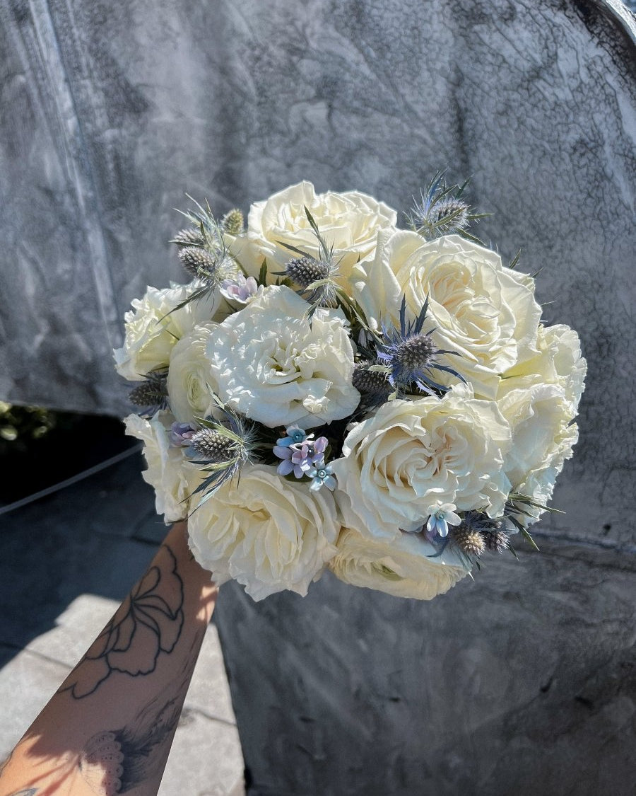 wedding-bouquet-frosted-bloom-ivory-roses-blue-eryngium-nyc