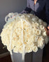 100-white-roses-in-basket-luxury-nyc-delivery
