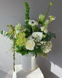 Green and white seasonal bouquet arrangement — elegant flower subscription by All Me Flowers.