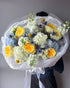 round-bouquet-lemon-sky-yellow-roses-blue-thistle-palette-bouquets-all-me-flowers-nyc