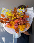 fall-bouquet-amber-yellow-roses-dahlias-orchids-autumn-leaves-seasonal-flower-delivery-nyc-palette-bouquets
