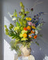 festival-colorful-flower-vase-arrangement-orange-yellow-green-blue-flowers-textural-design-palette-bouquets-NYC-florist