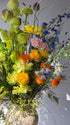 festival-colorful-flower-vase-arrangement-orange-yellow-green-blue-flowers-textural-design-palette-bouquets-NYC-florist