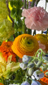 festival-colorful-flower-vase-arrangement-orange-yellow-green-blue-flowers-textural-design-palette-bouquets-NYC-florist