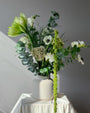 Green and white seasonal bouquet arrangement — elegant flower subscription by All Me Flowers.
