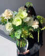 Green and white seasonal bouquet arrangement — elegant flower subscription by All Me Flowers.
