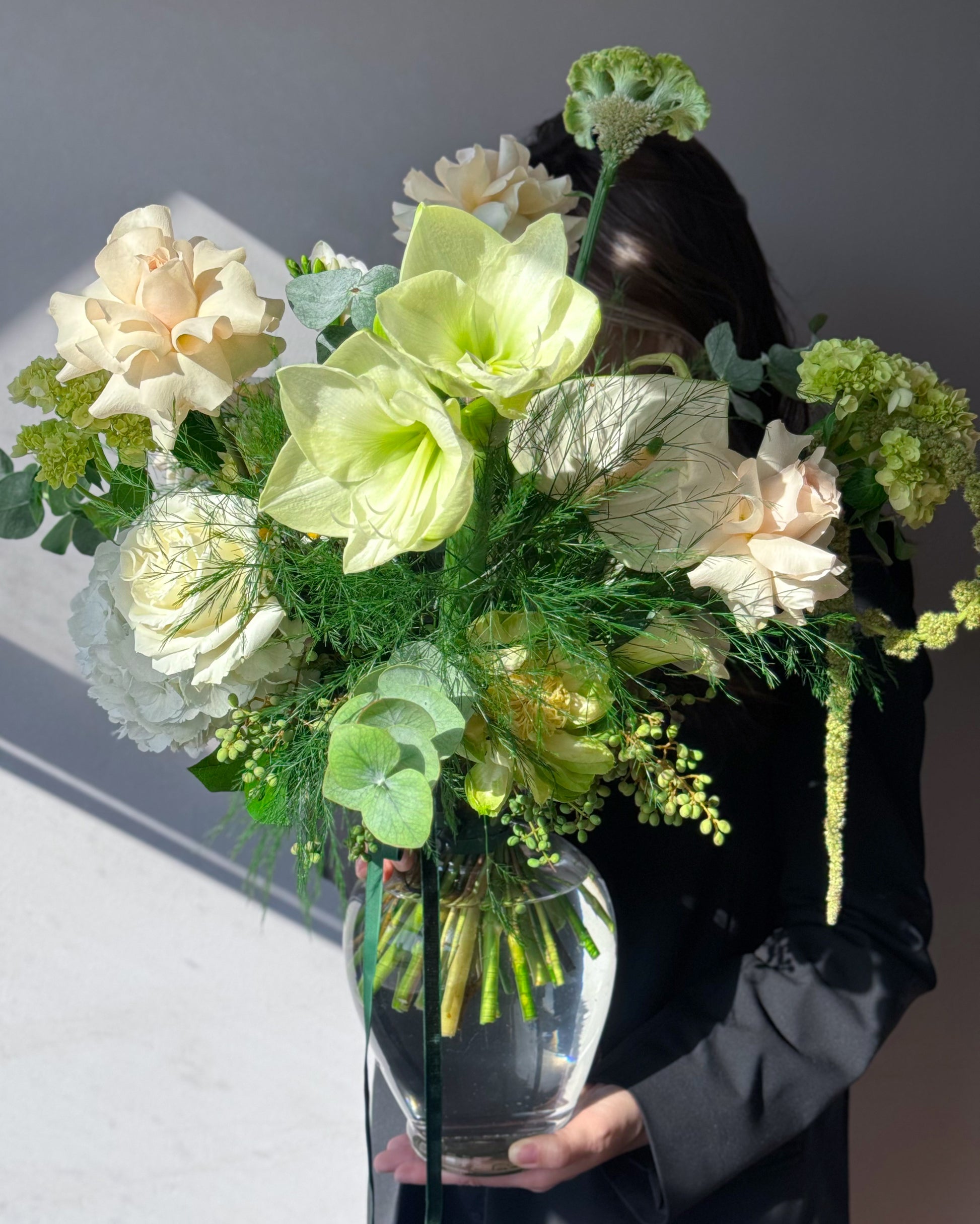 Green and white seasonal bouquet arrangement — elegant flower subscription by All Me Flowers.