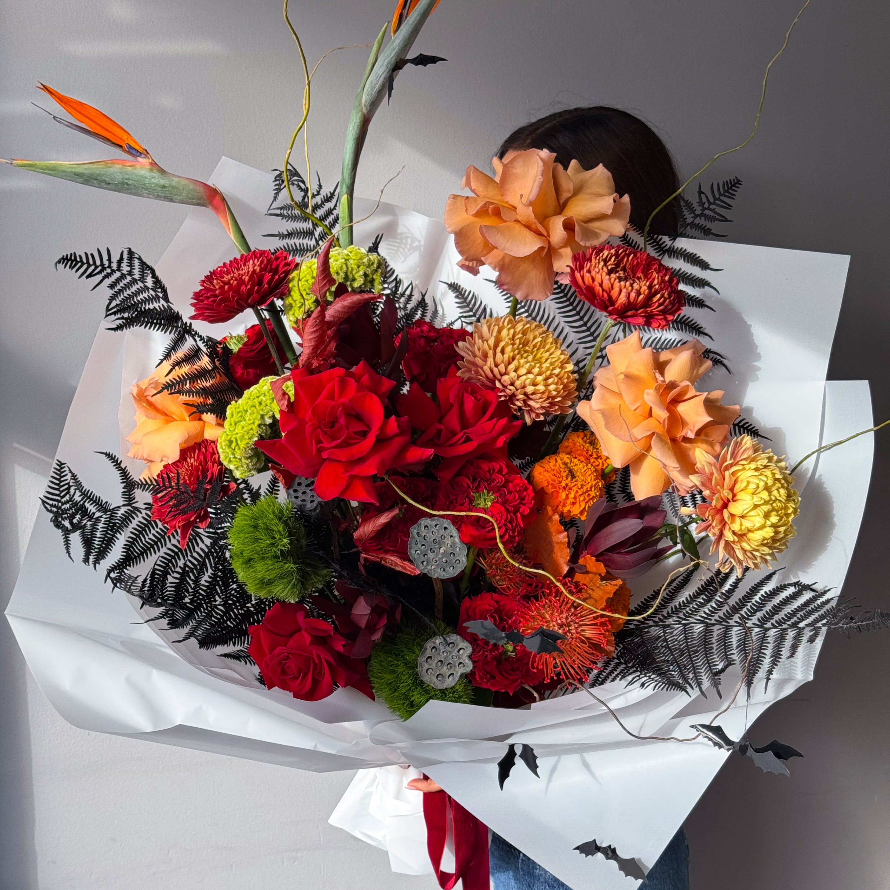 flow-bouquet-inferno-red-orange-roses-chrysanthemums-birds-of-paradise-halloween-all-me-flowers-nyc