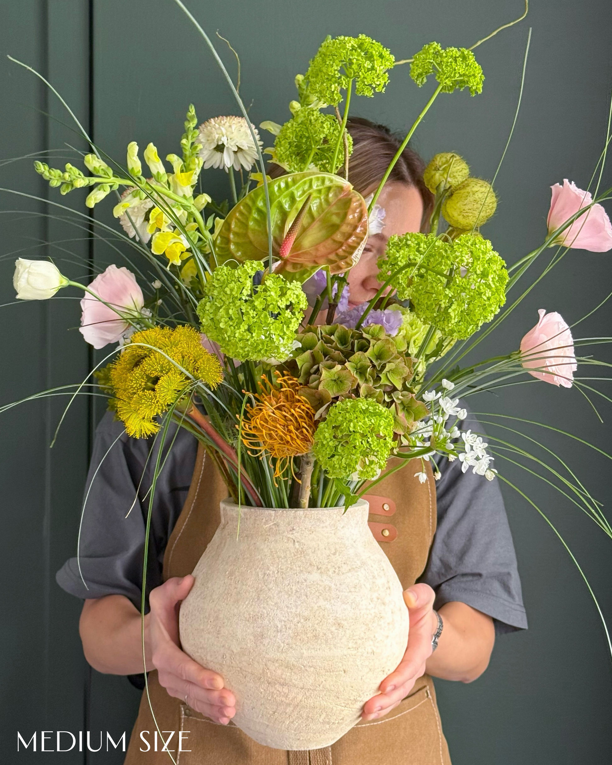 festival-colorful-flower-vase-arrangement-orange-yellow-green-blue-flowers-textural-design-palette-bouquets-NYC-florist