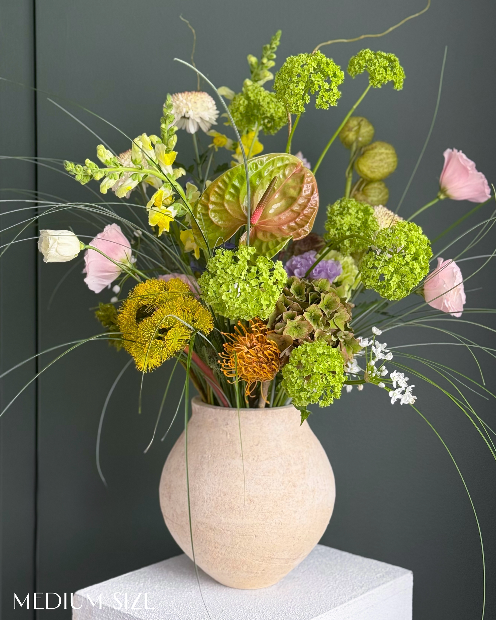 festival-colorful-flower-vase-arrangement-orange-yellow-green-blue-flowers-textural-design-palette-bouquets-NYC-florist