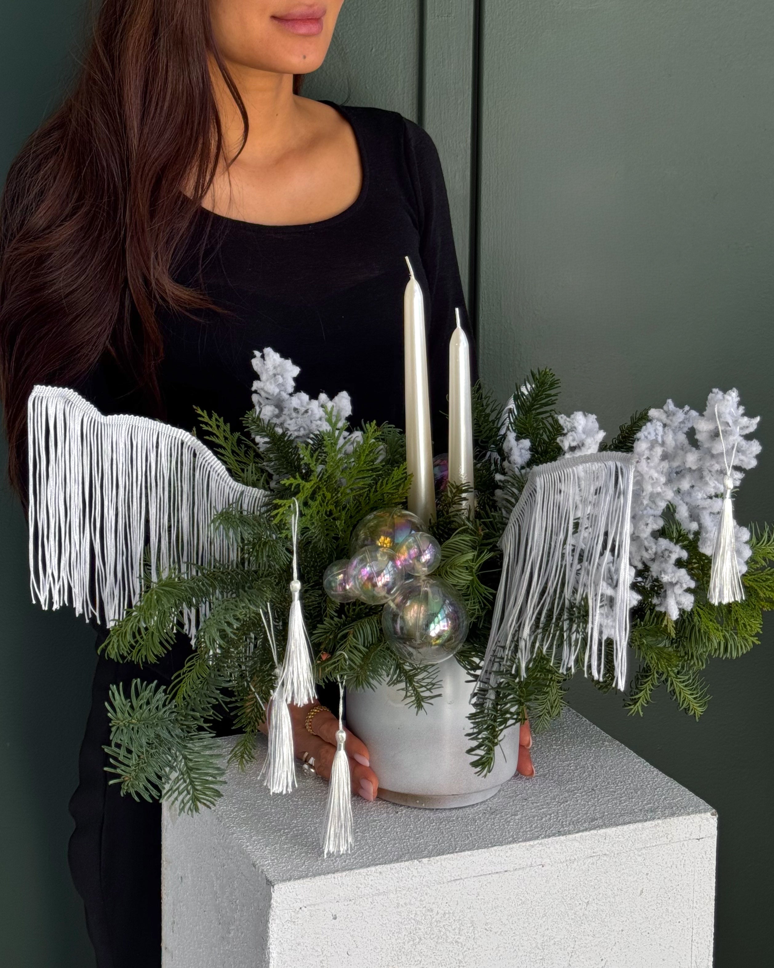candle-arrangement-snow-queen-winter-evergreens-snowy-branches-white-fringe-two-candles-all-me-flowers-nyc
