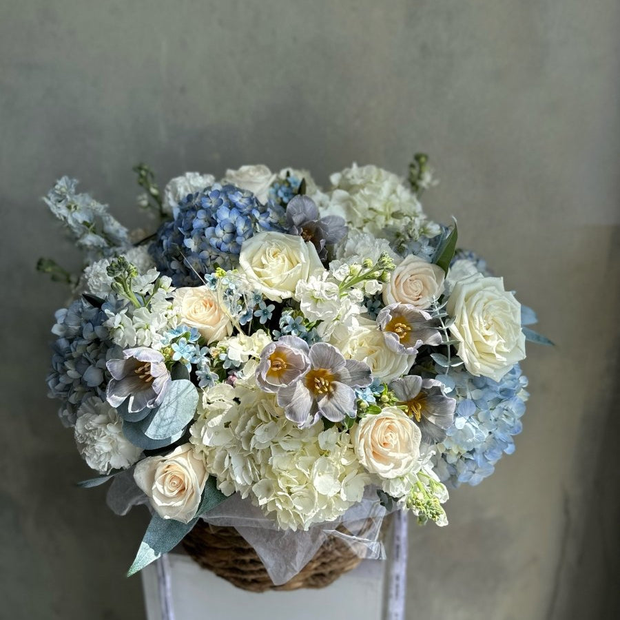 Basket “Baby Blue” - hydrangeas, roses, stock, seasonal flowers - All Me Flowers