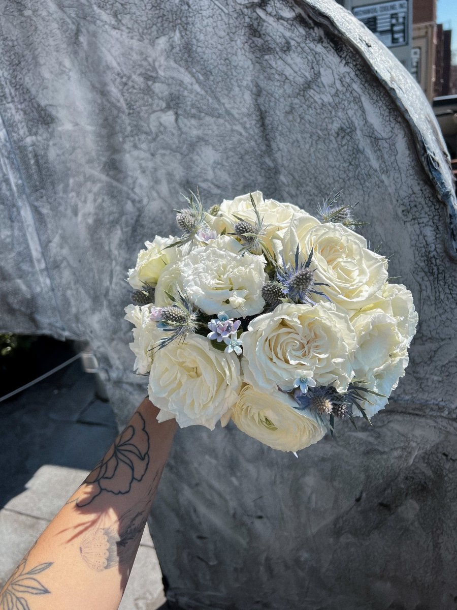 wedding-bouquet-frosted-bloom-ivory-roses-blue-eryngium-nyc