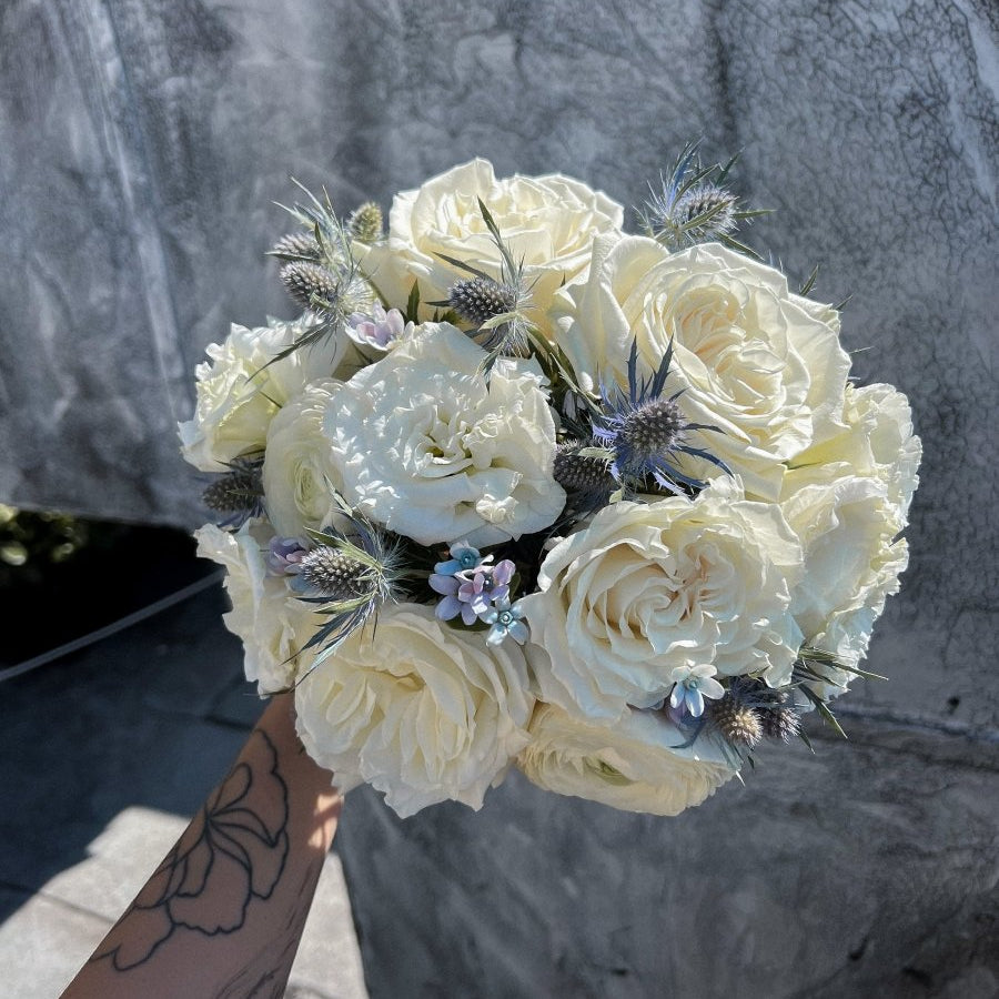 wedding-bouquet-frosted-bloom-ivory-roses-blue-eryngium-nyc