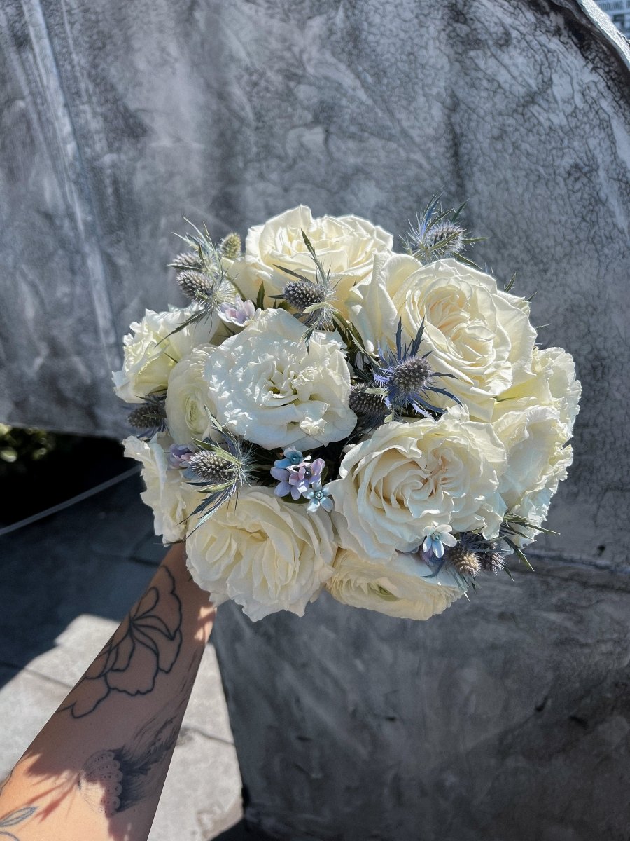 wedding-bouquet-frosted-bloom-ivory-roses-blue-eryngium-nyc